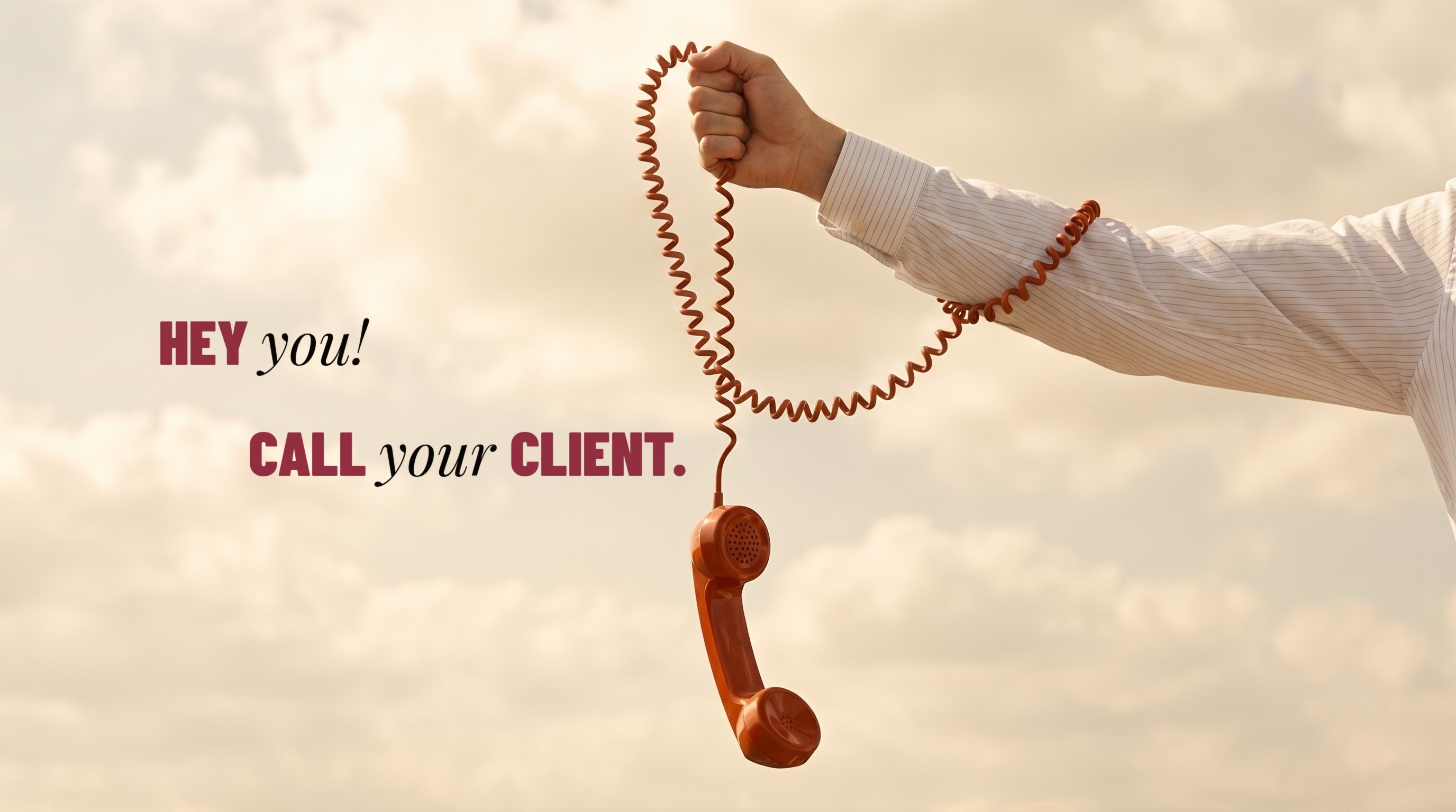 An outstretched arm holding a coiled orange telephone handset against an open sky, with the words Hey you! Call your client.